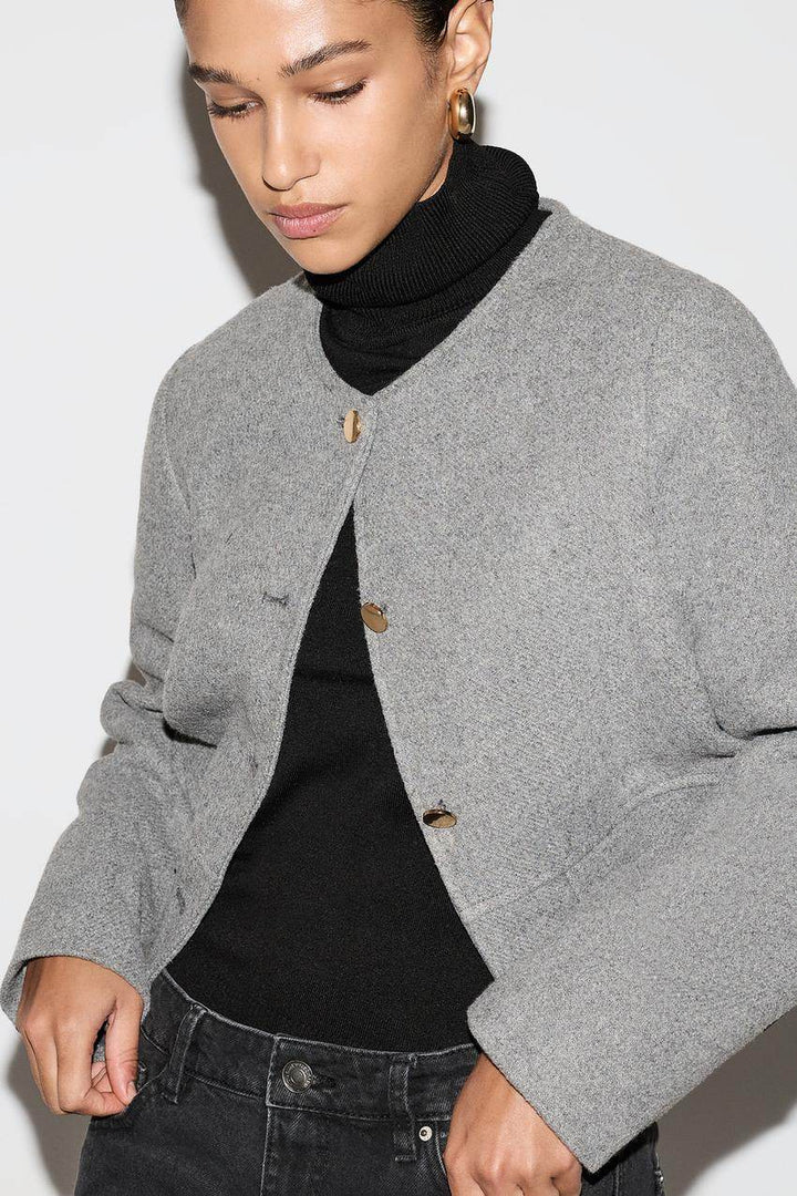 Zoomed front view of a grey women's cloth jacket
