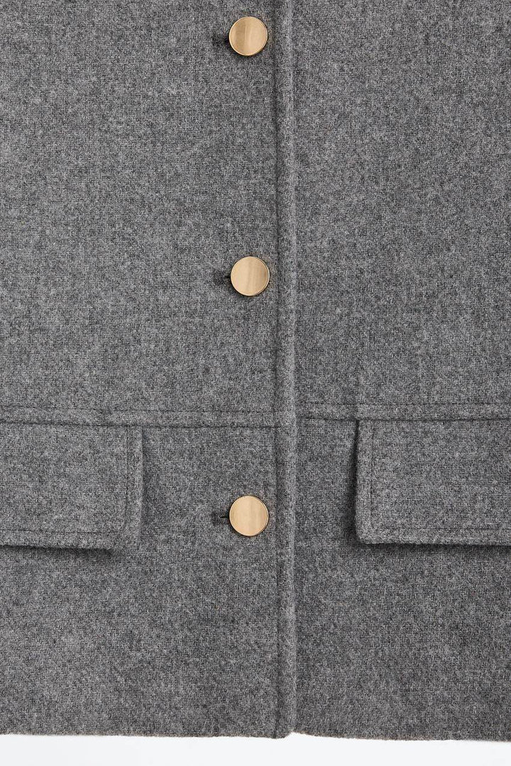 Zoomed view of a grey women's cloth jacket
