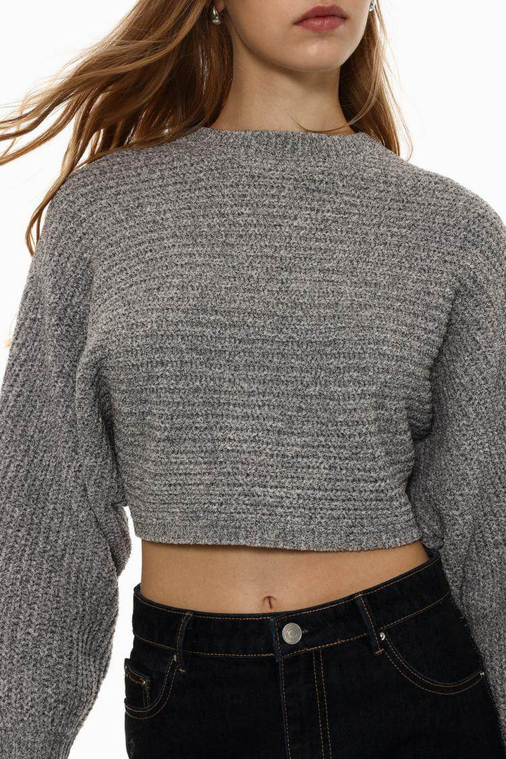 Close-up front view of grey chenille sweater

