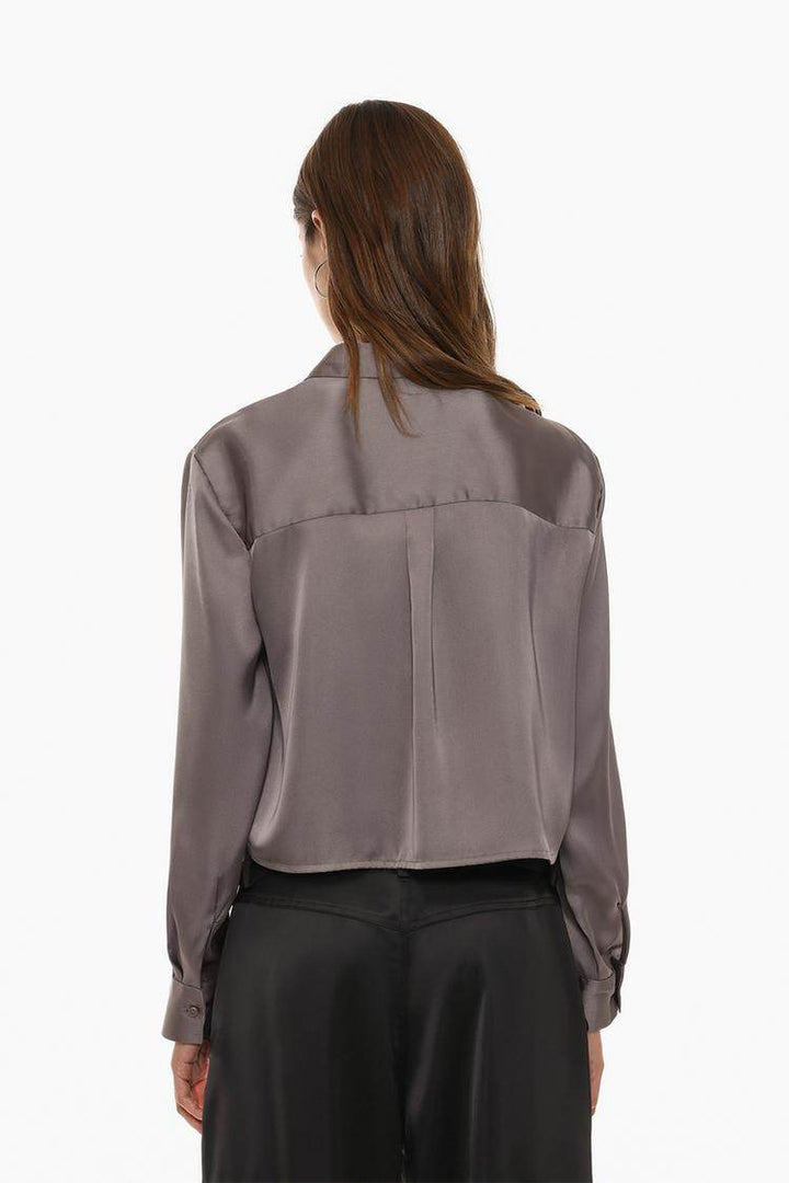 Back view of the women's grey cropped satin shirt

