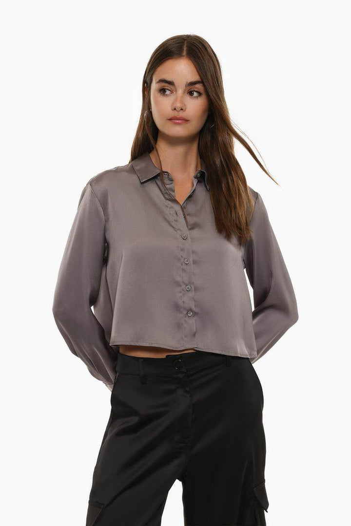 Front view of women's grey cropped satin shirt

