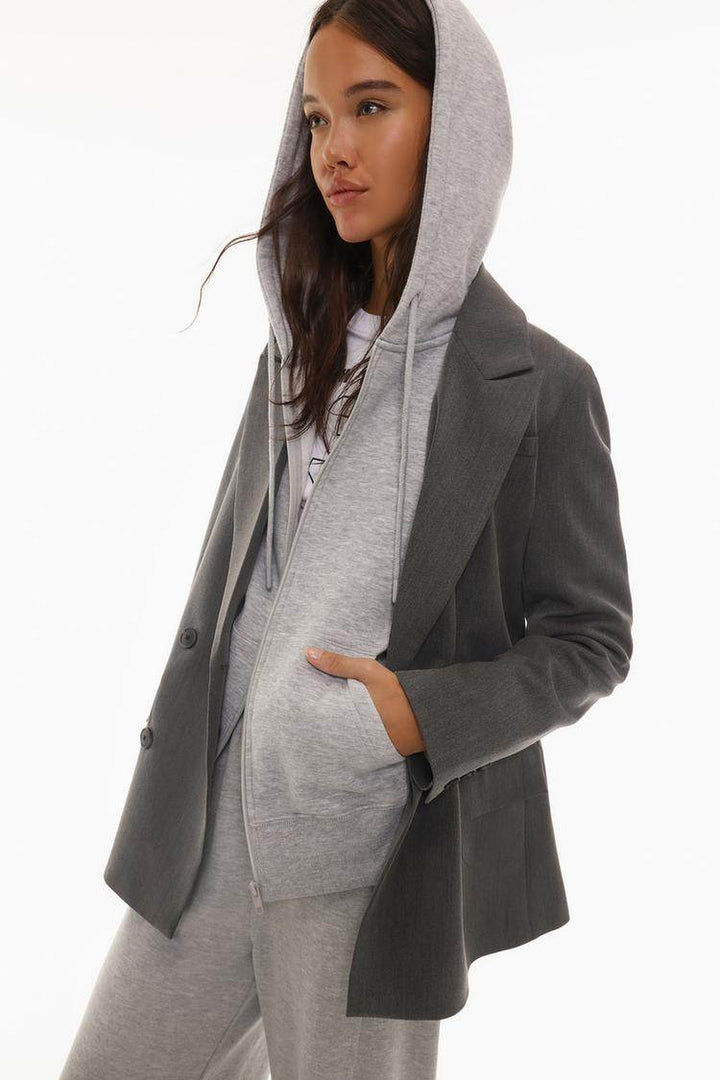 Side view of the women's grey hooded jacket

