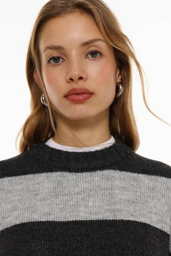 Close-up front view of grey soft sweater

