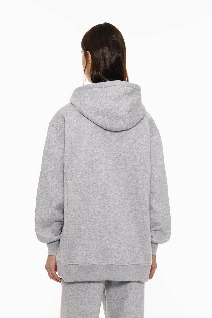 Back view of the women's grey oversized plush sweatshirt

