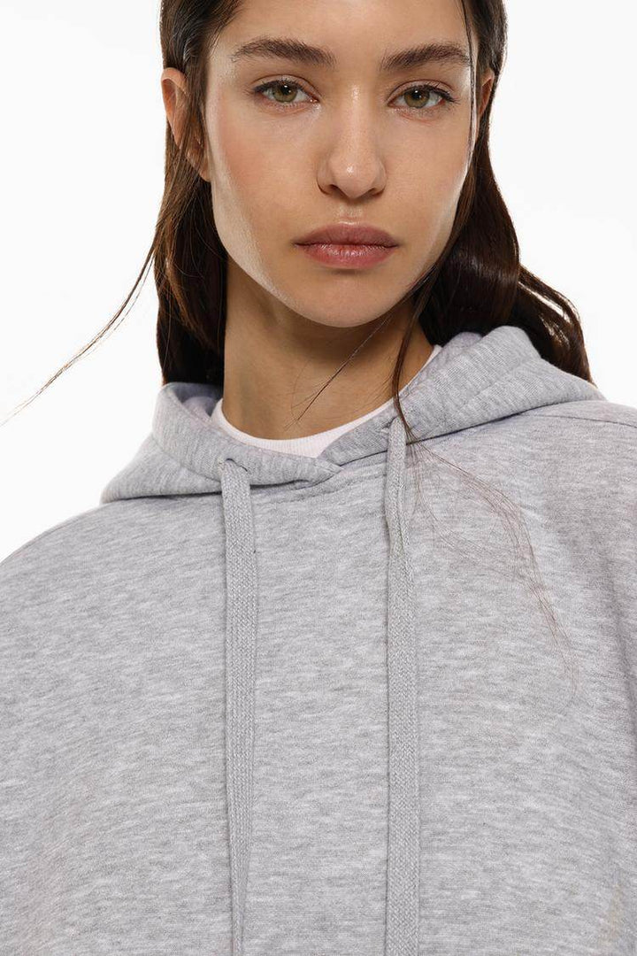 Close-up front view of grey plush sweatshirt

