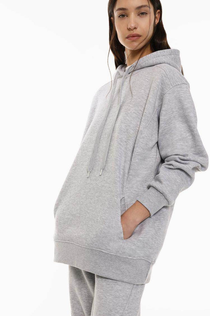 Side view of the women's grey oversized plush sweatshirt

