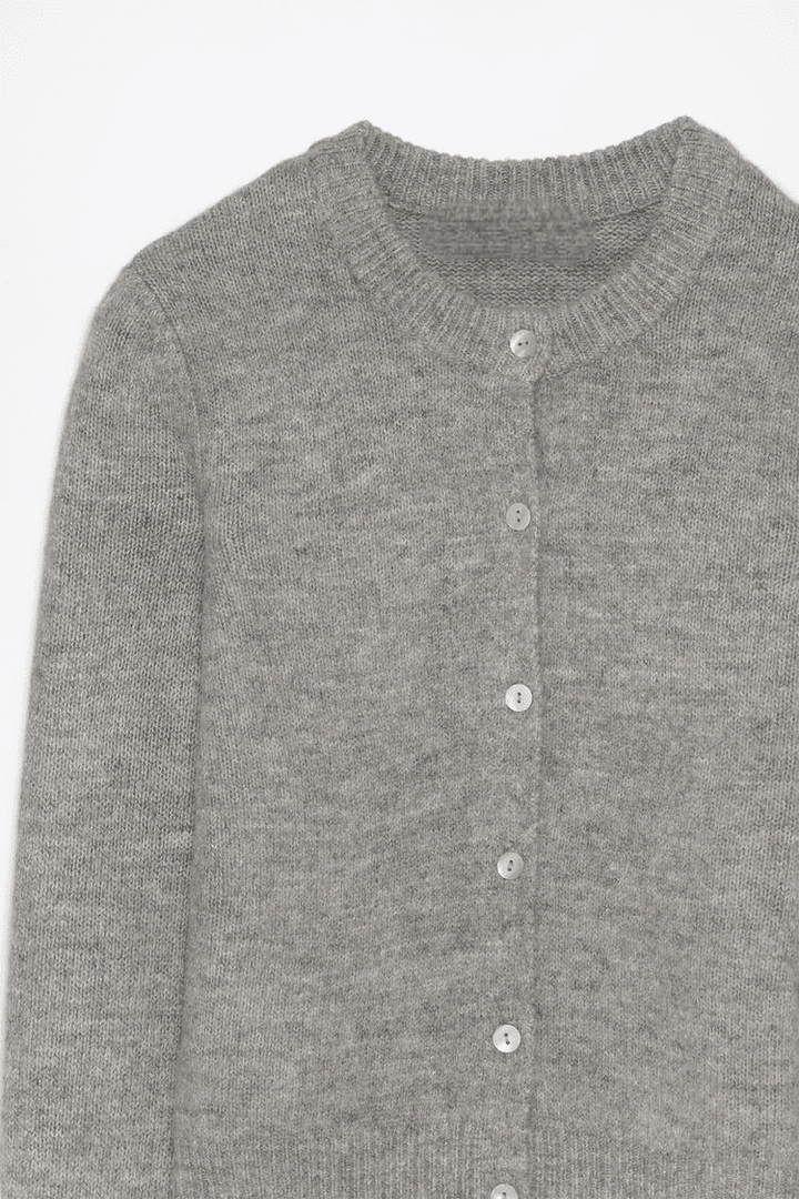 Close-up product image of grey knit cardigan

