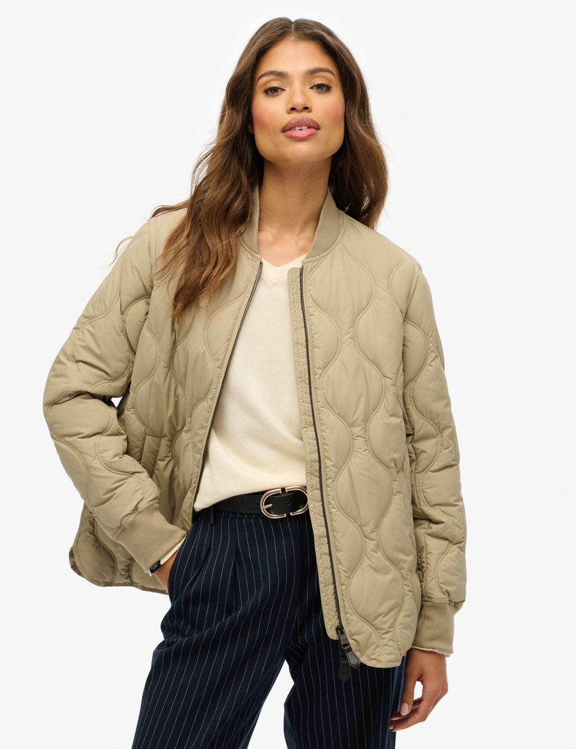 Front view of a women's khaki baseball collar jacket

