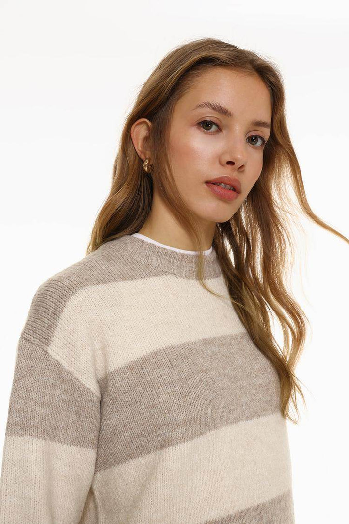 Side view of the women's khaki long soft sweater

