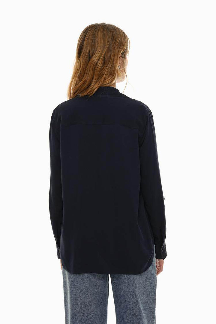 Back view of the women's navy shirt with pockets

