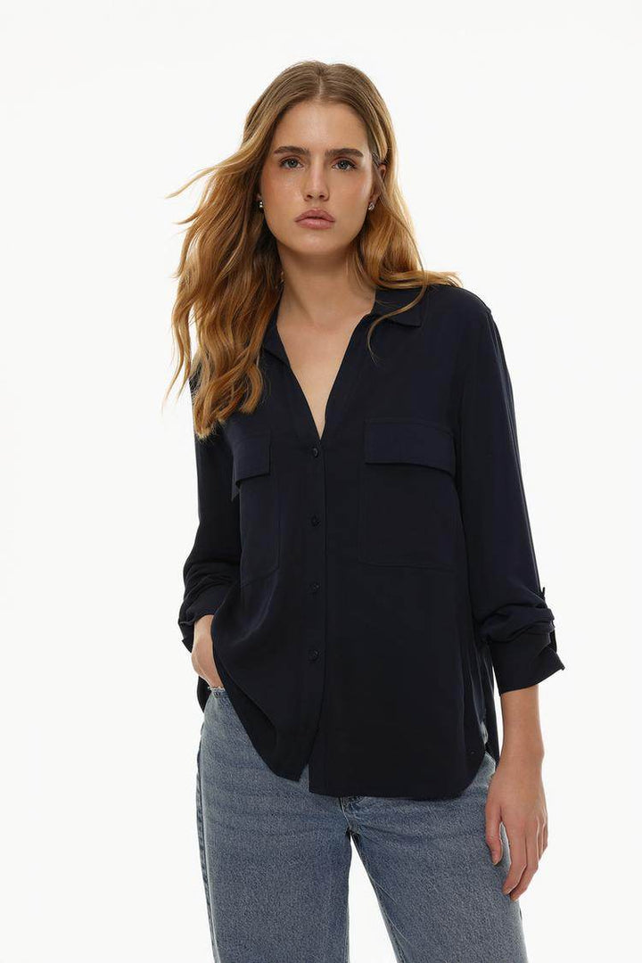 Front view of women's navy shirt with pockets

