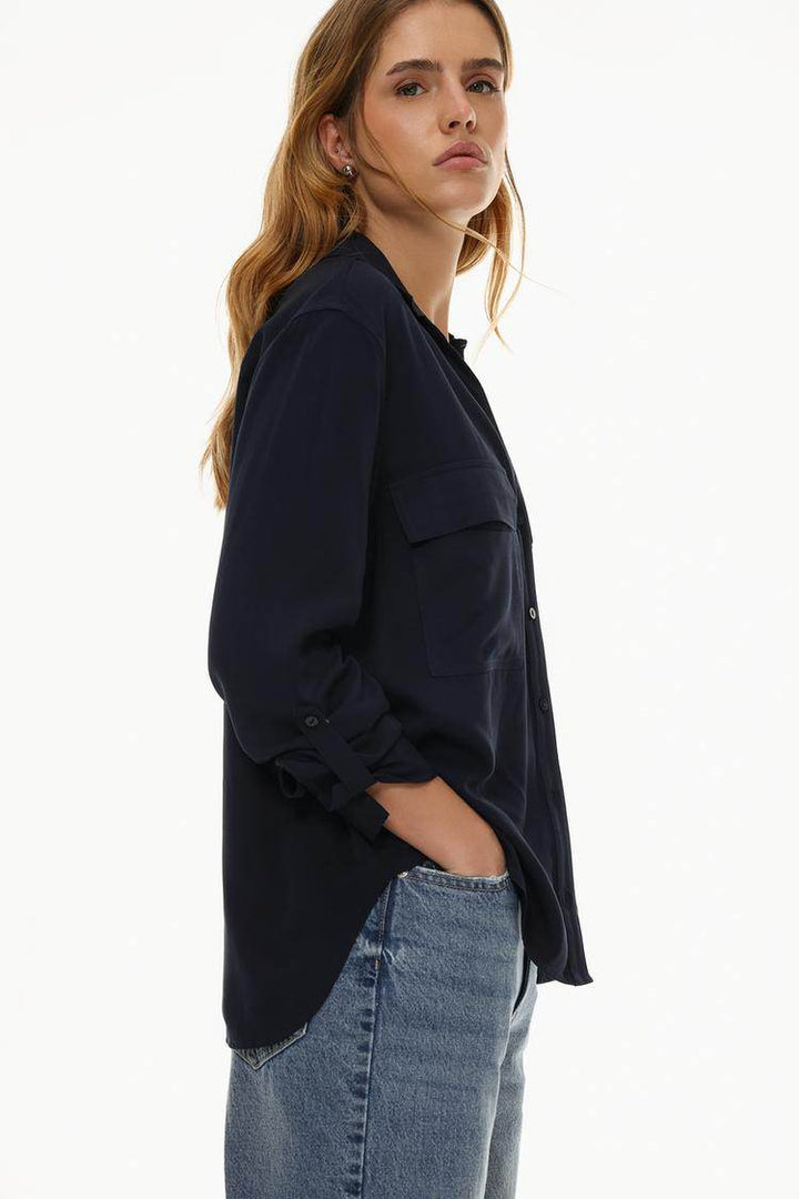 Side view of the women's navy shirt with pockets

