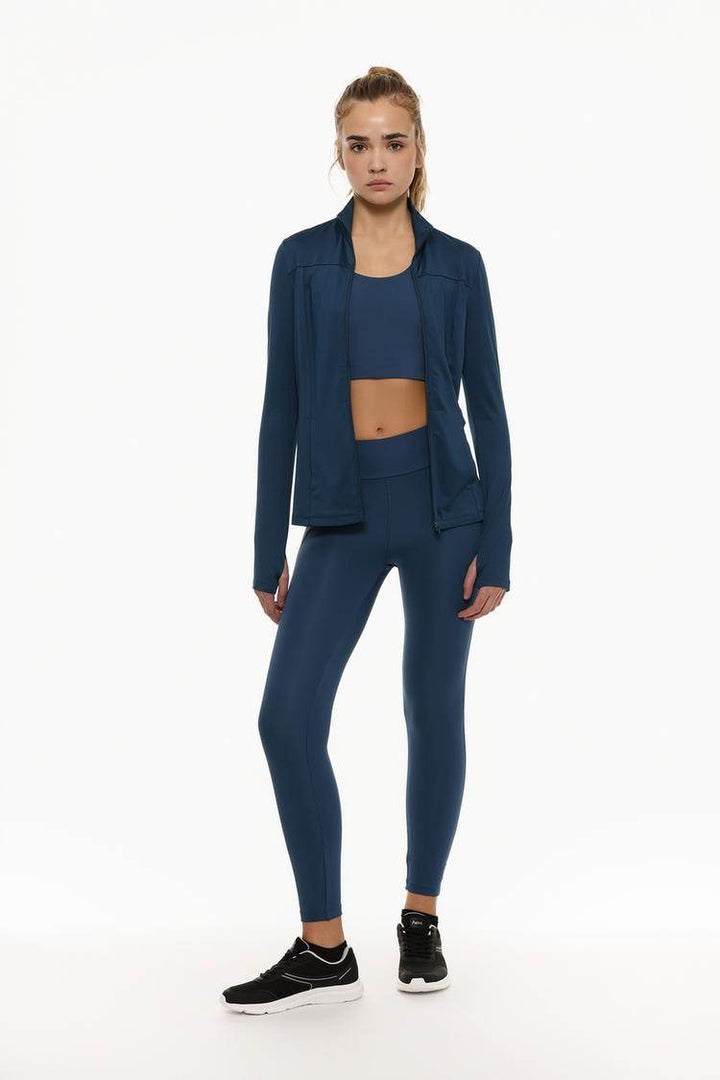 Full body front view of woman wearing navy sports jacket

