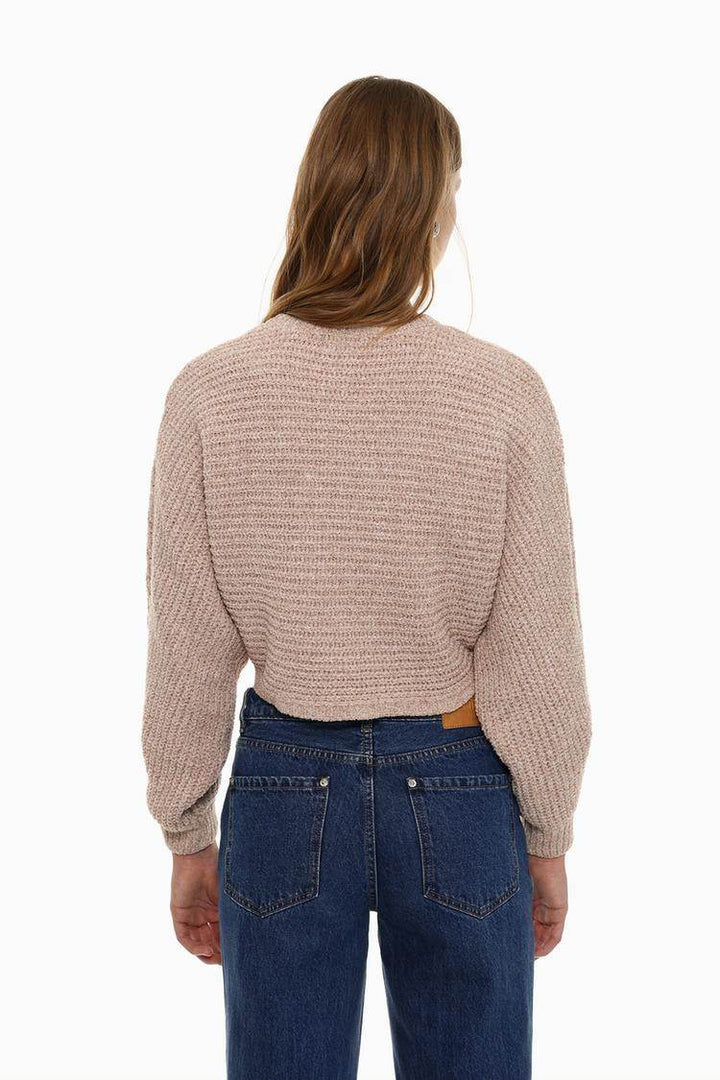 Back view of the women's pink cropped chenille sweater

