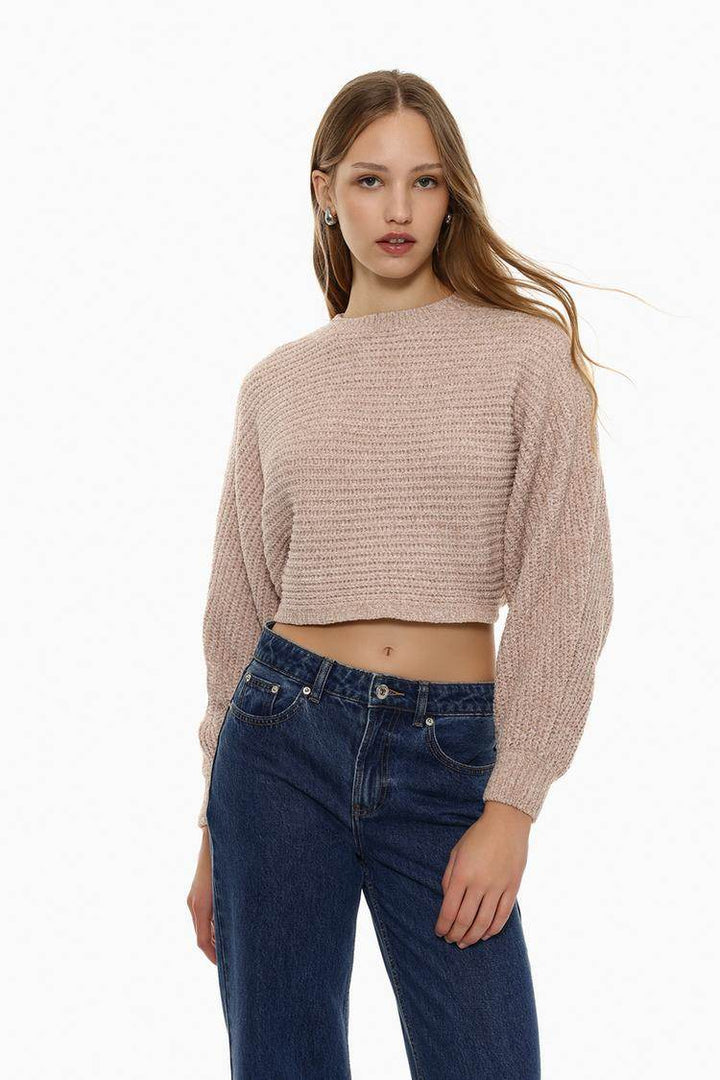 Front view of women's pink cropped chenille sweater

