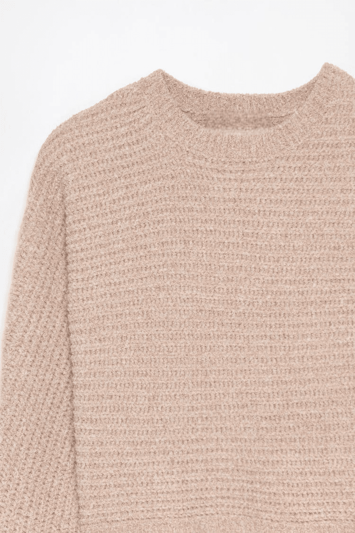 Close-up product image of pink chenille sweater

