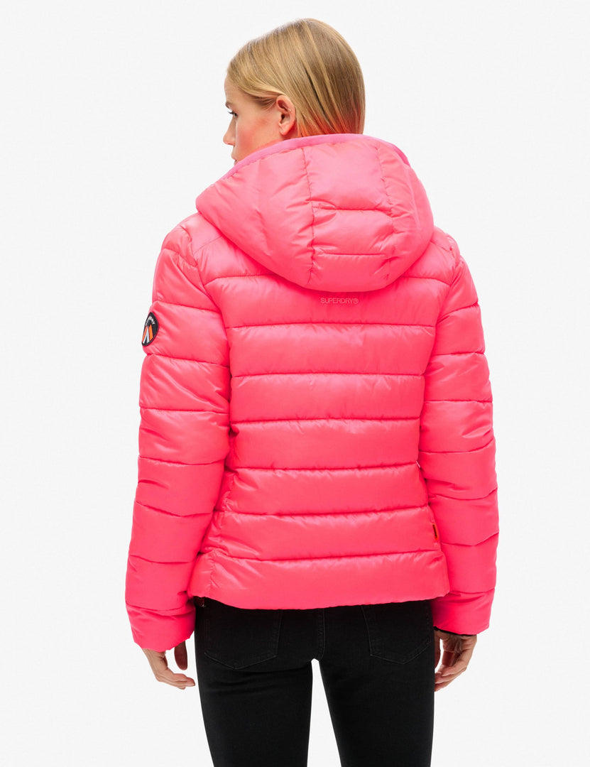 Back view of the women's pink hooded puffer jacket

