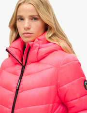 Front view of a women's pink hooded padded puffer jacket


