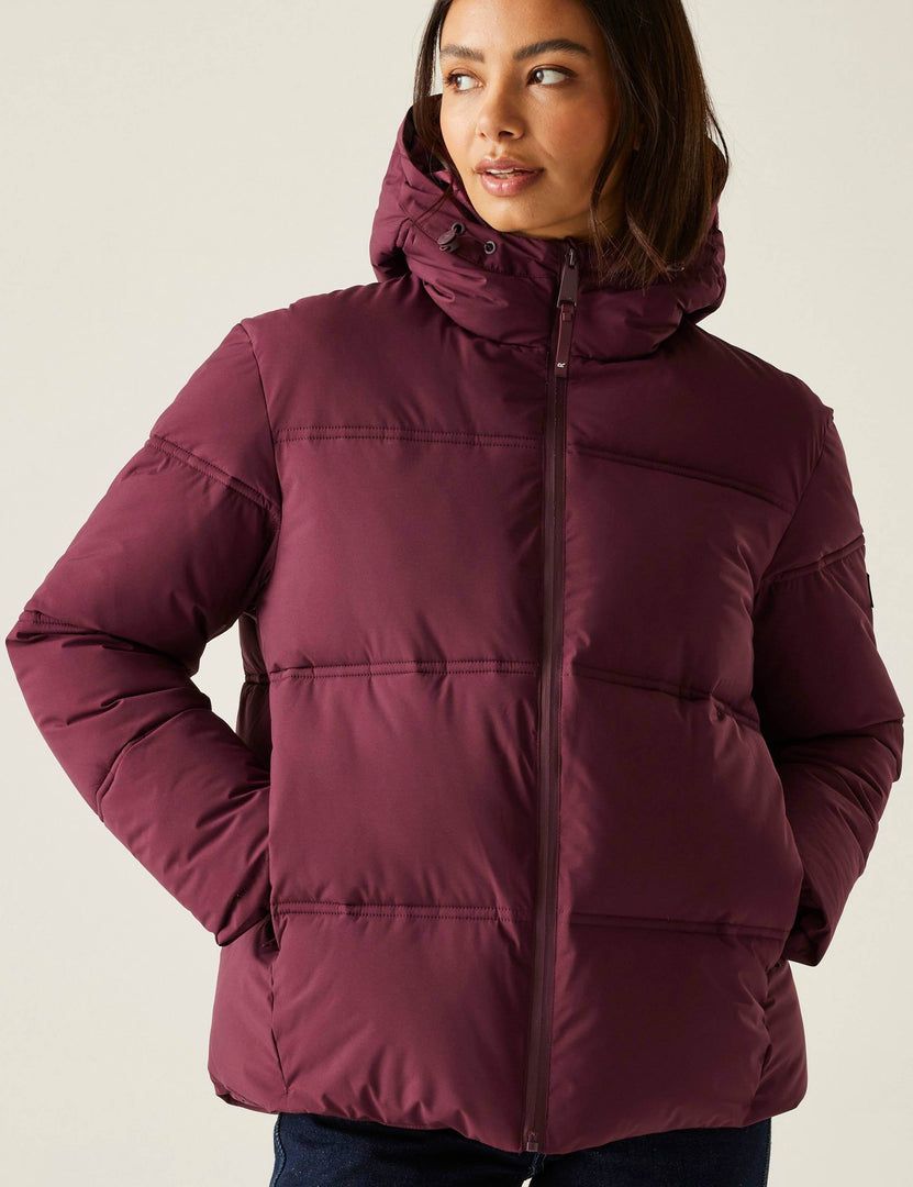 Front view of a women's purple quilted hooded puffer jacket

