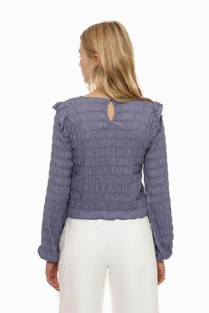 Back view of the women's purple ruffle blouse

