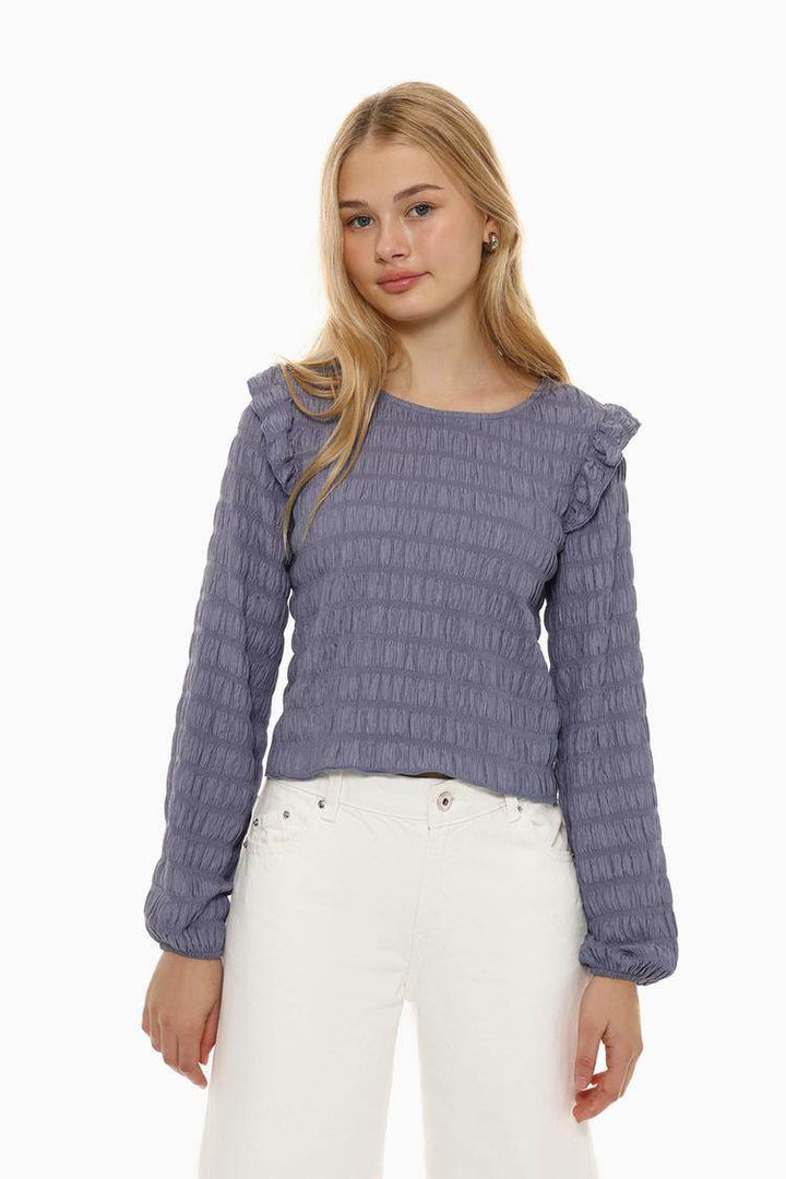 Front view of women's purple ruffle blouse

