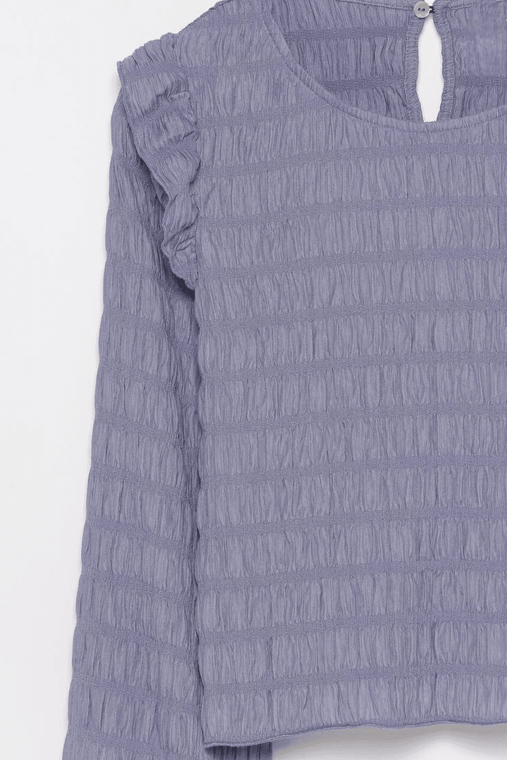 Close-up product image of purple ruffle blouse

