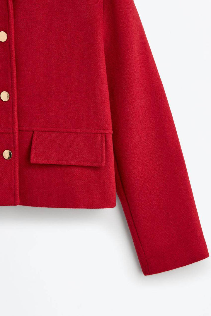 Zoomed side view of a red women's cloth jacket
