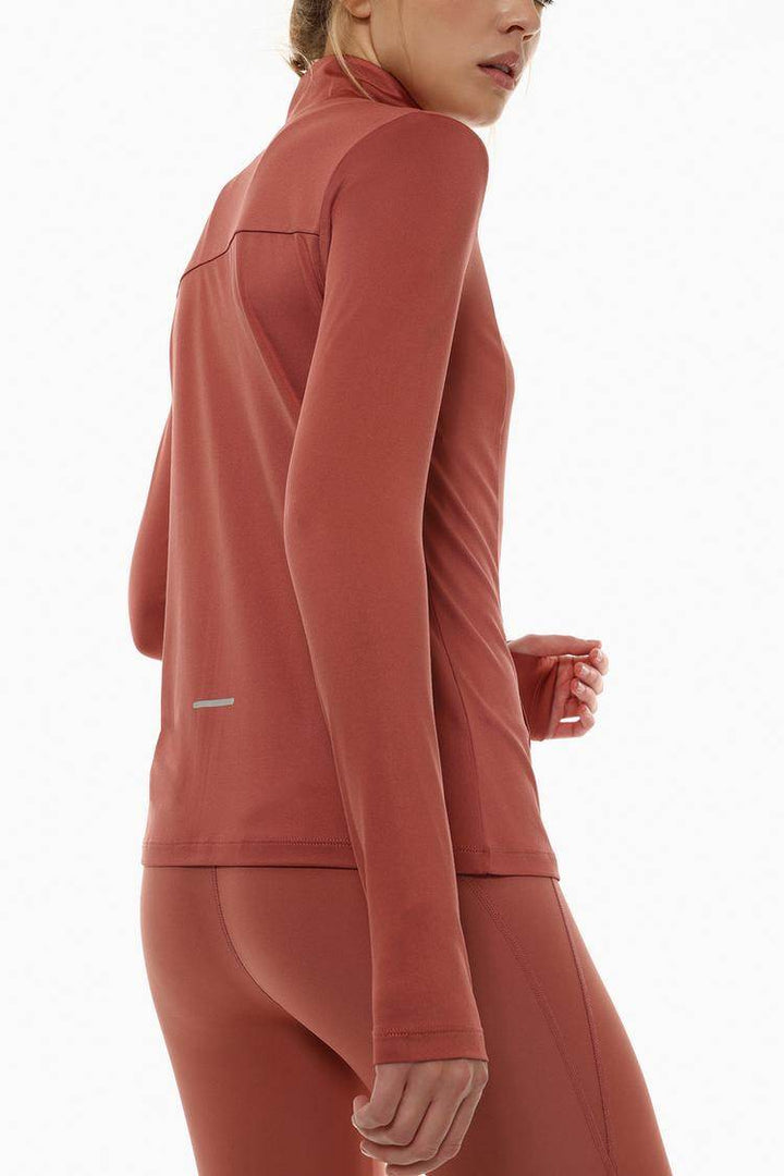 Side view of the women's red sports jacket

