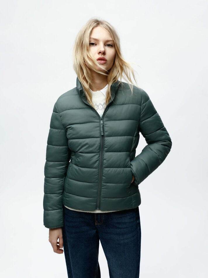 Front view of women's turquoise lightweight puffer jacket

