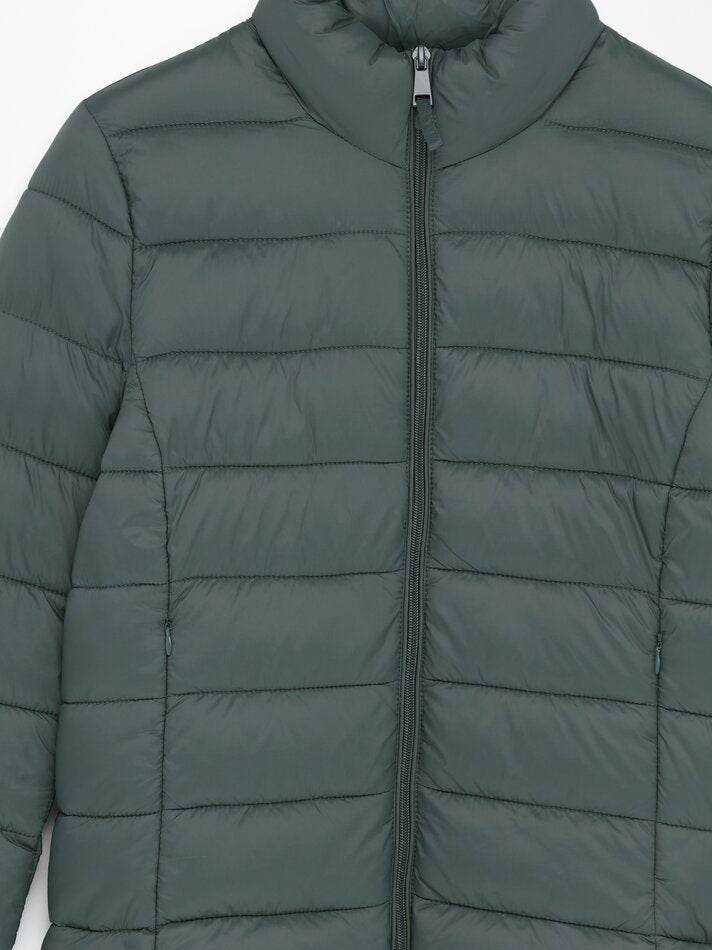 Close-up product image of turquoise puffer jacket

