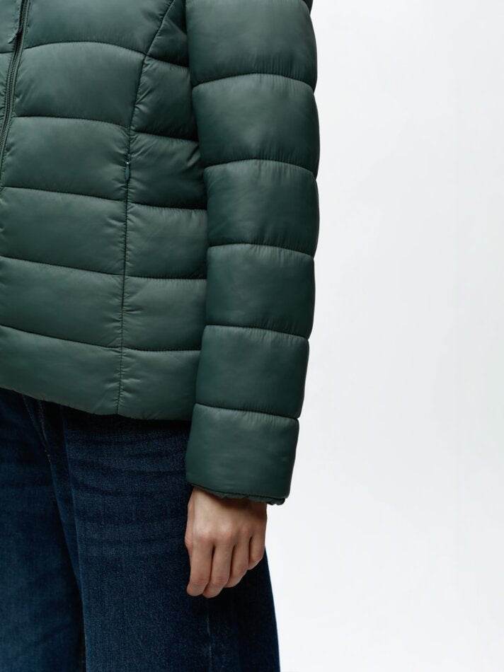 Side view of the women's turquoise lightweight puffer jacket

