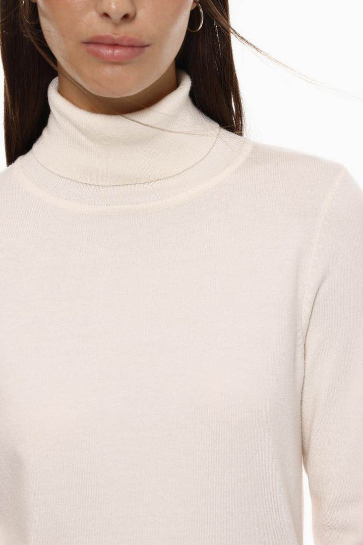Close-up front view of white turtleneck sweater

