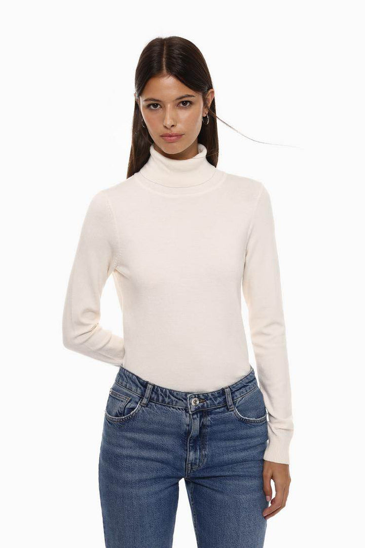 Front view of women's white basic turtleneck sweater

