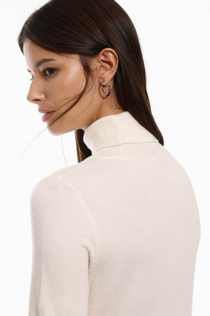 Side view of the women's white basic turtleneck sweater

