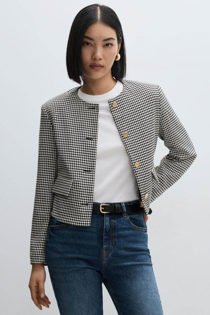 Front view of a white women's cropped blazer
