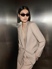 Front view of a white women's pinstripe blazer
