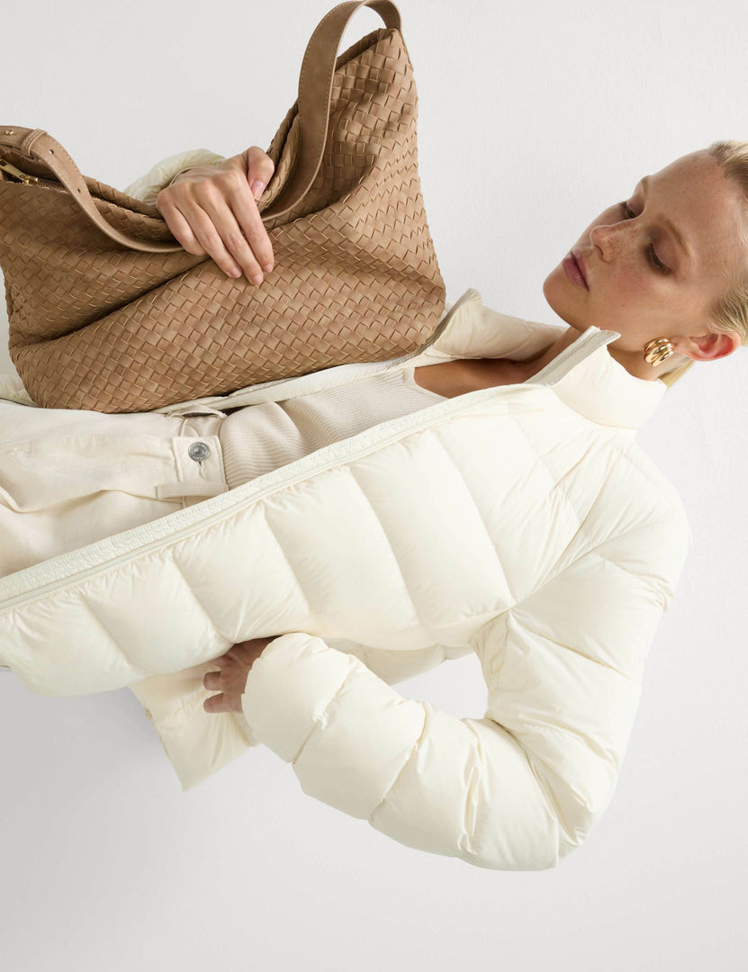 Close-up product image of the white puffer jacket's details

