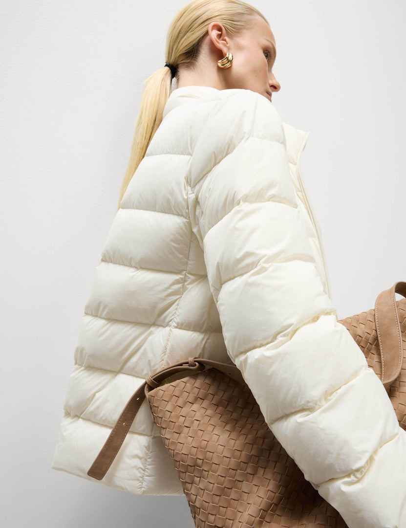 Left side view of the women's white puffer jacket

