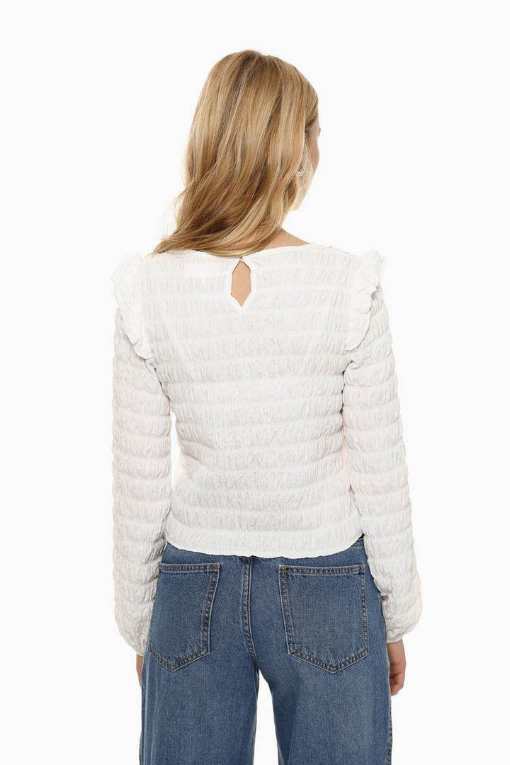 Back view of the women's white ruffle blouse

