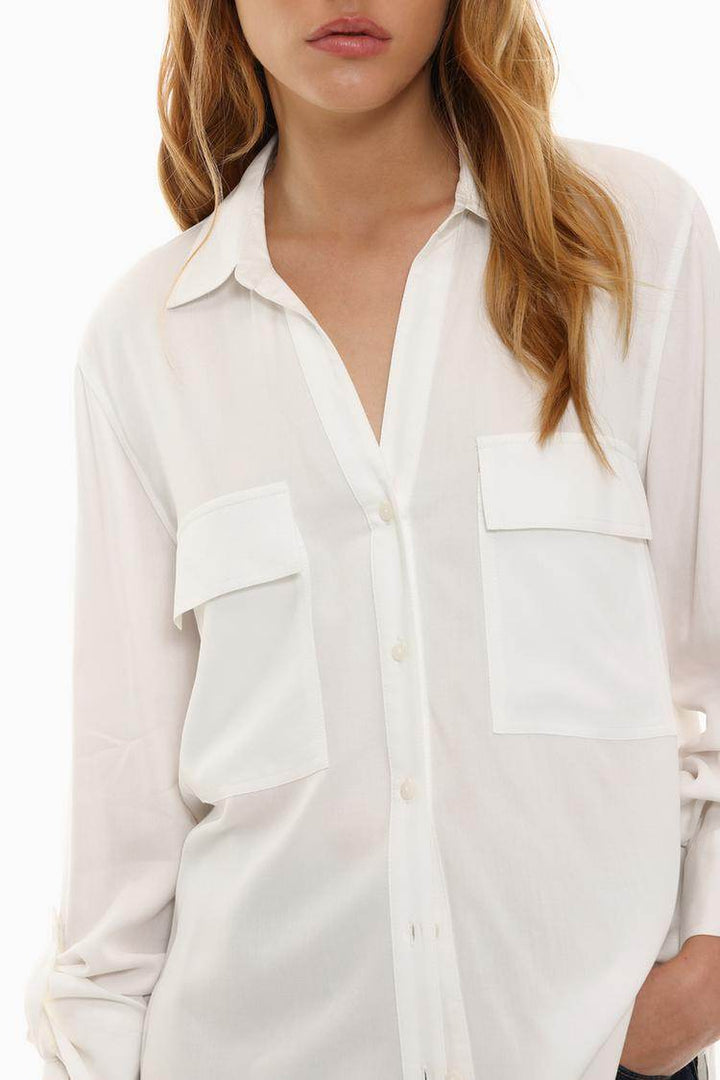 Close-up front view of white shirt pocket details

