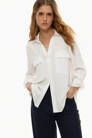 Front view of women's white shirt with pockets

