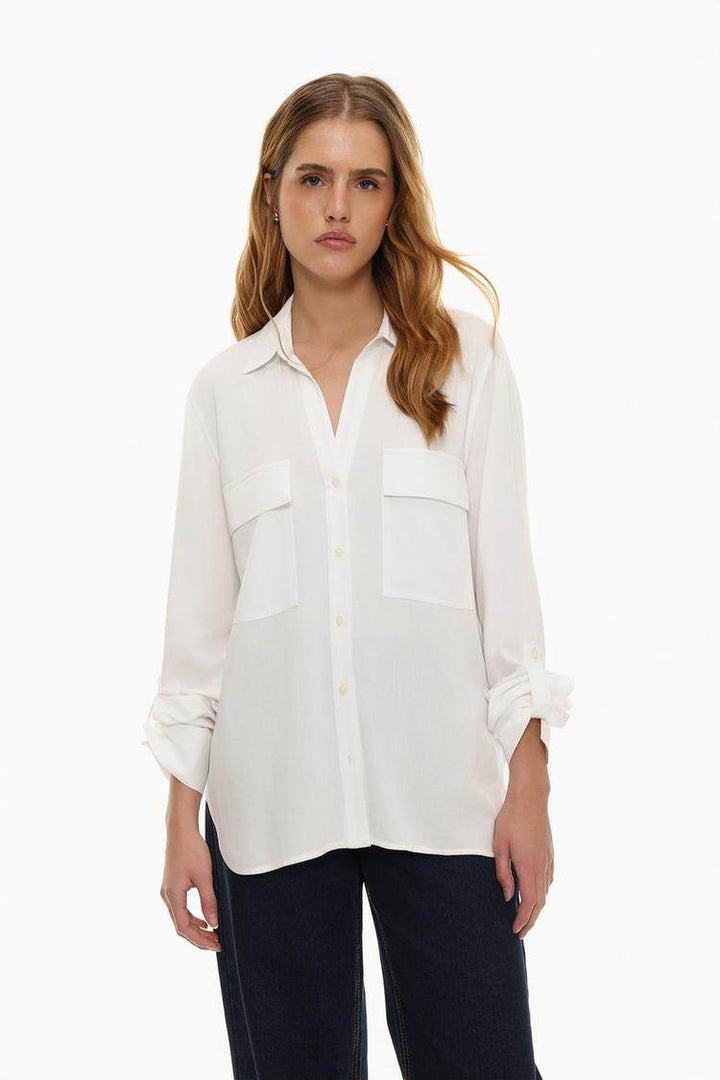 Model showcasing white shirt with pockets front view

