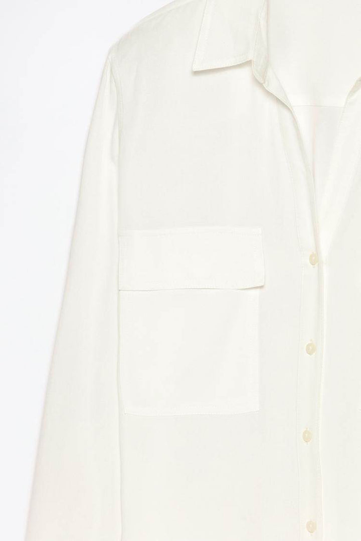Close-up product image of white shirt pockets

