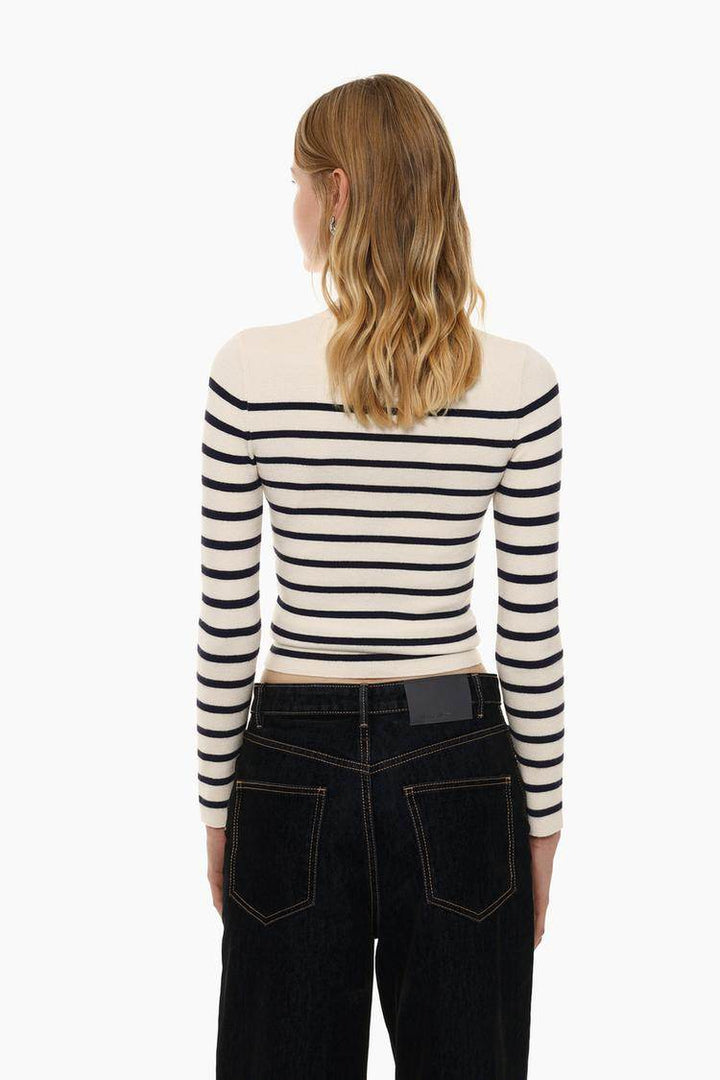 Back view of the women's white turtleneck sweater

